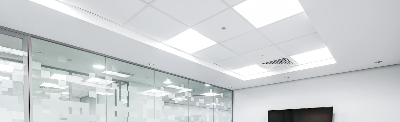 Clean commercial suspended ceiling with recessed lighting